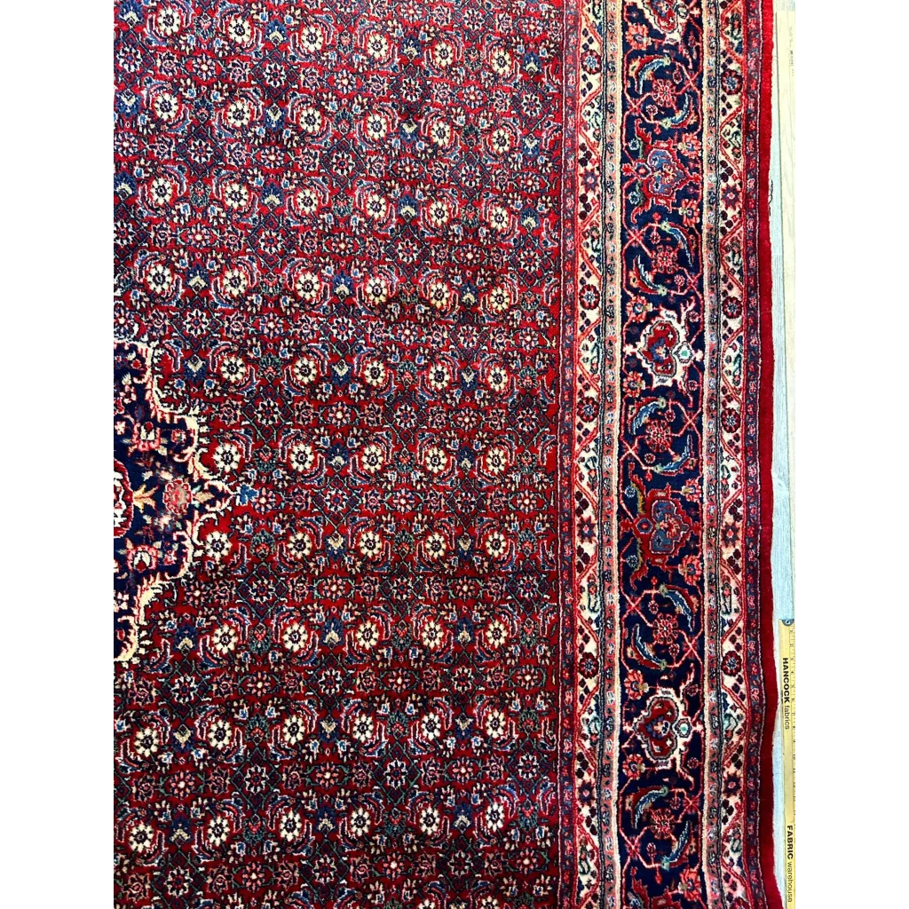 Vintage fine Persian rug in deep red with intricate blue floral patterns