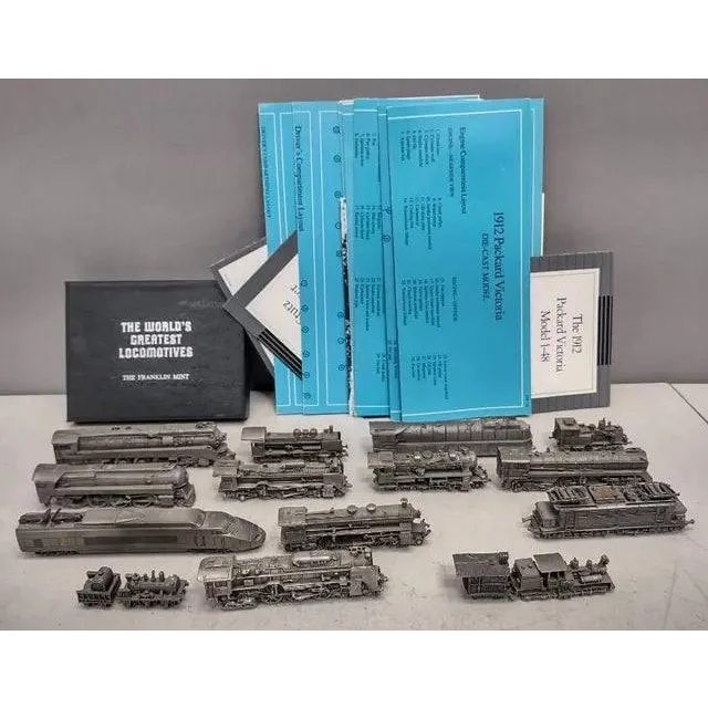 Vintage Franklin Mint pewter locomotives collection with models and docs for train fans