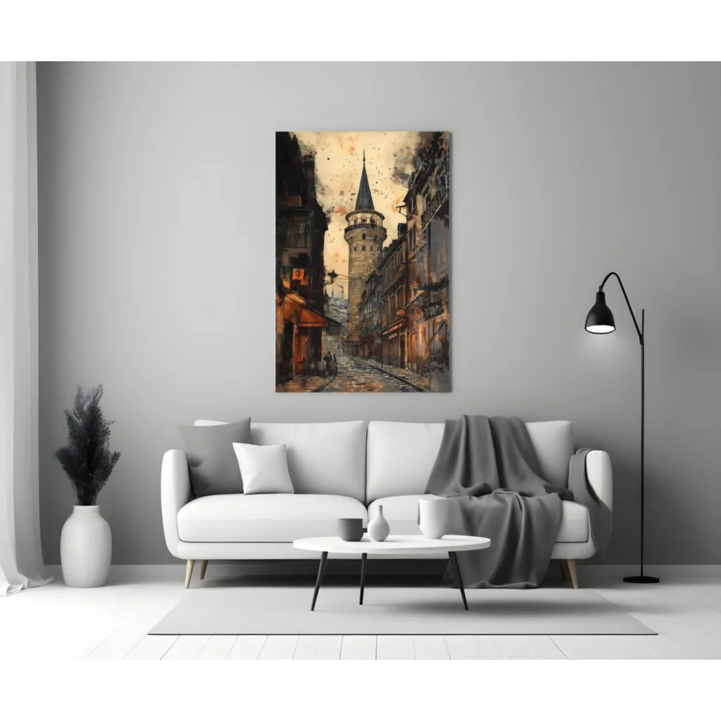 White leather couch with modern metal legs and gray throw blanket under Vintage Galata Tower glass wall art