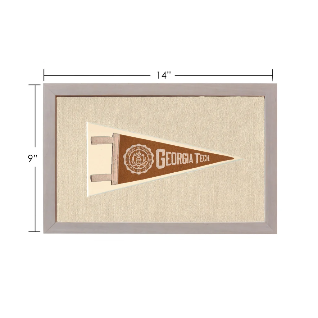 Vintage Georgia Tech pennant in brown cream frame on textured fabric
