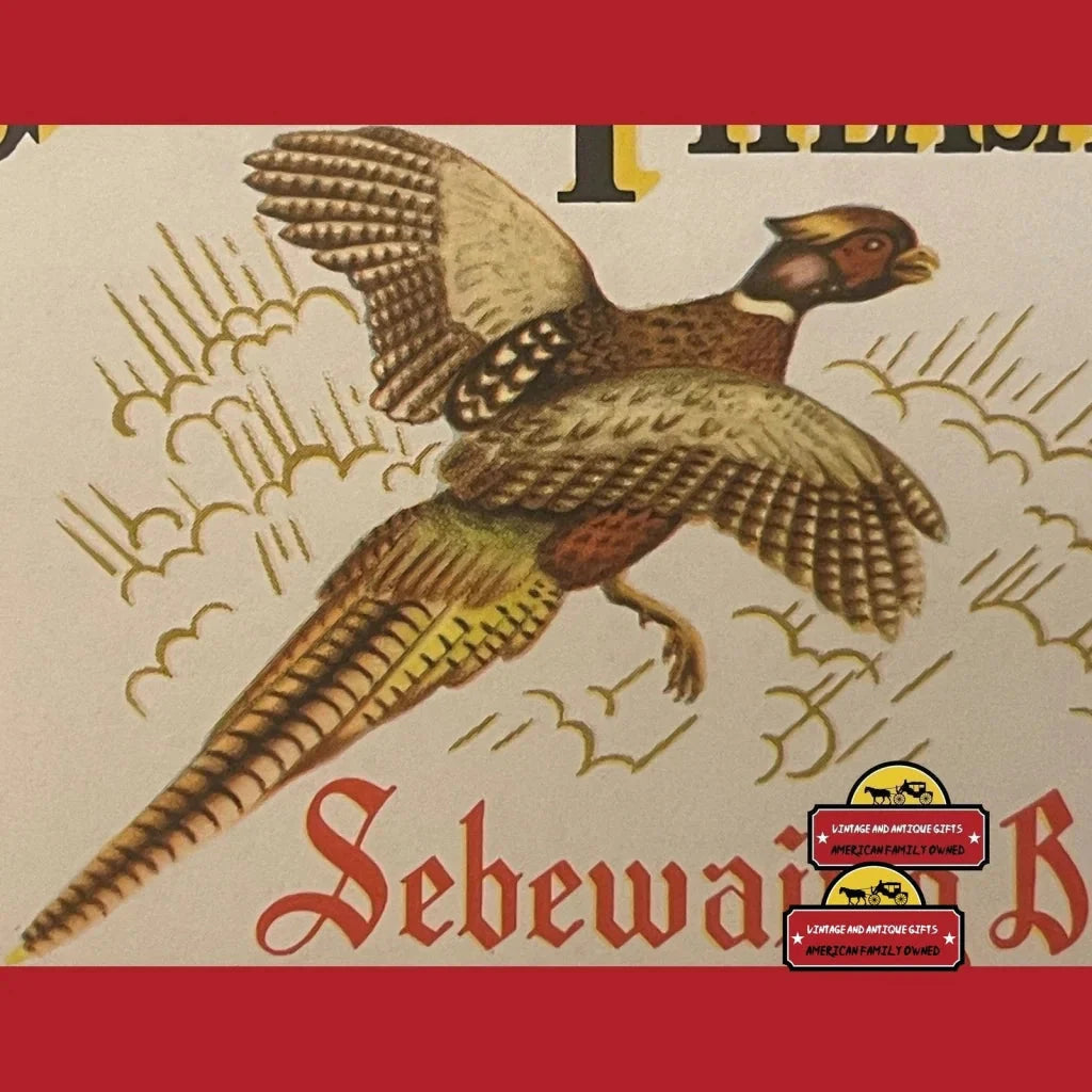 Golden Pheasant in flight with wings spread, featured on a vintage beer label