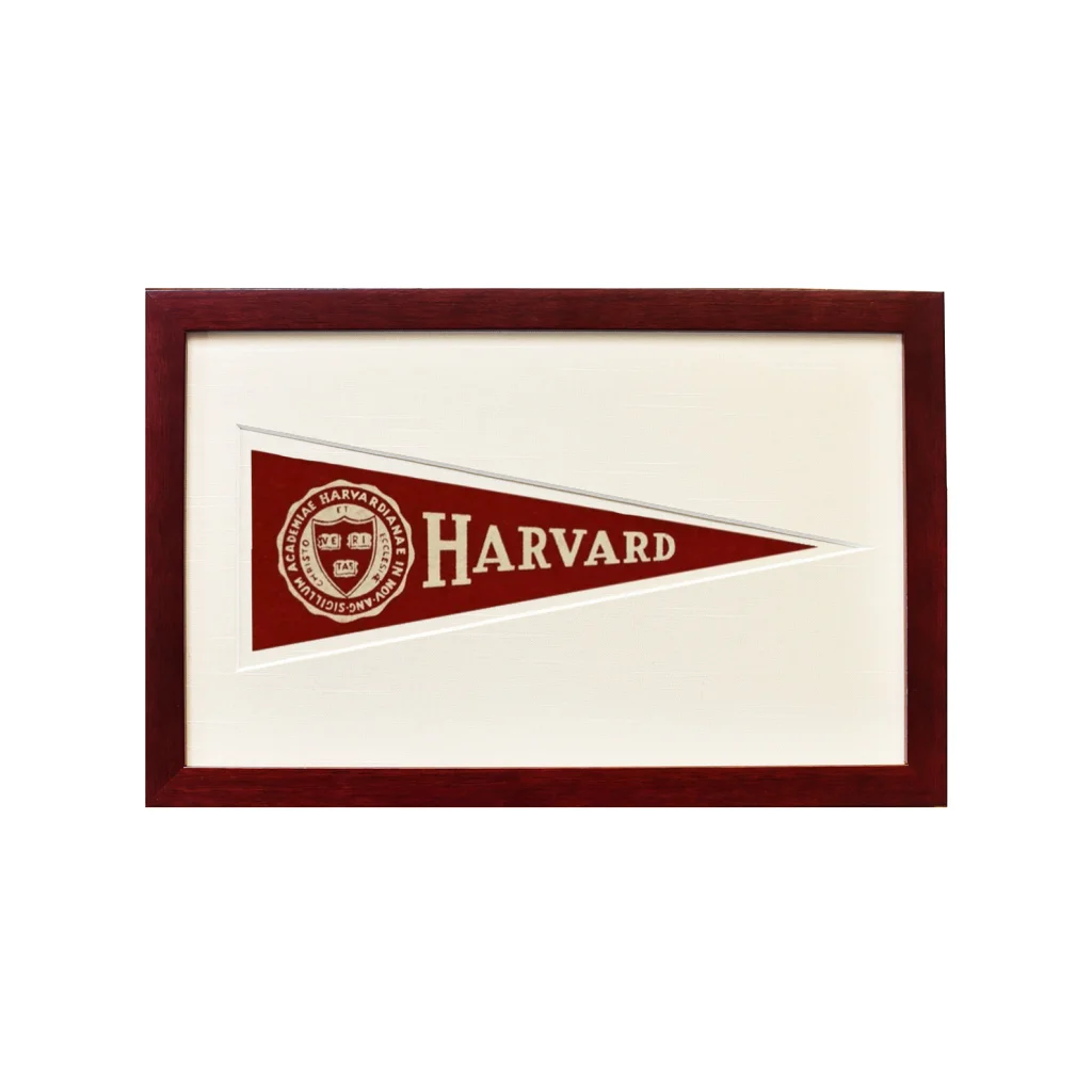 Vintage Harvard wool felt pennant in maroon and cream, framed in dark wood