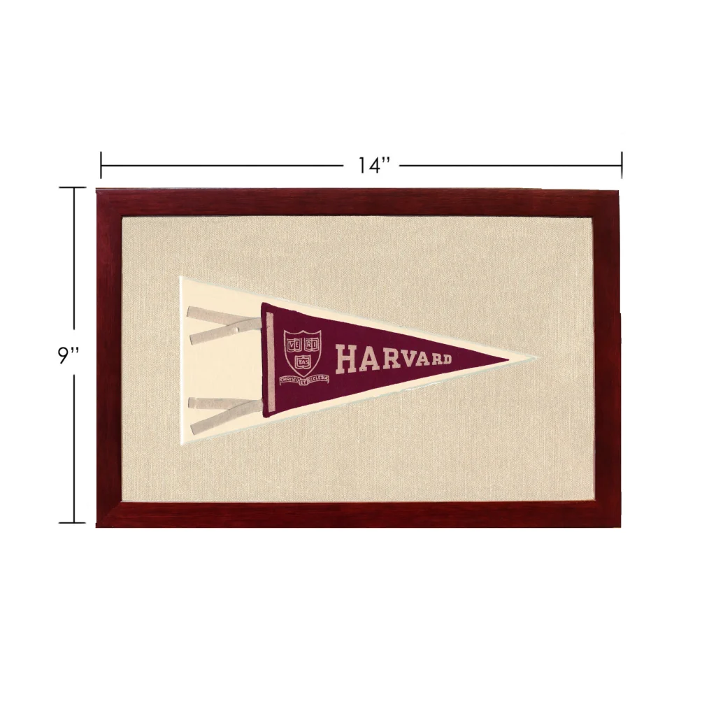 Vintage Harvard pennant in maroon and cream, framed in dark wood