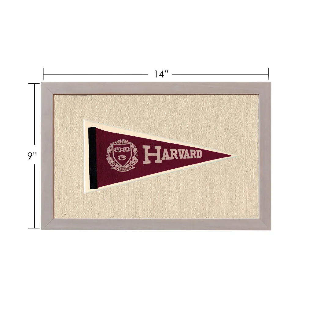 Vintage Harvard pennant in maroon with white crest, framed