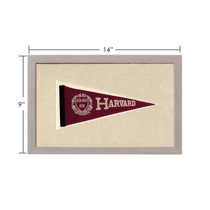 Vintage Harvard pennant in maroon with white crest, framed