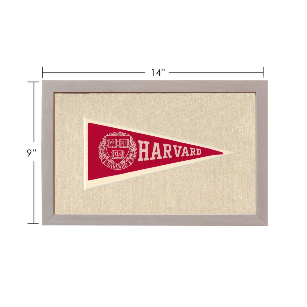 Vintage Harvard pennant in red and cream with white border, framed in gray