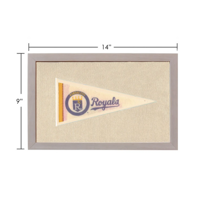Vintage Kansas City Royals pennant in cream with purple gold logo, gray frame