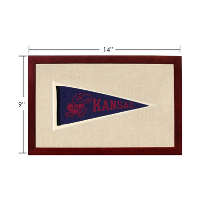 Vintage Kansas pennant in navy blue with red lettering and mascot, framed