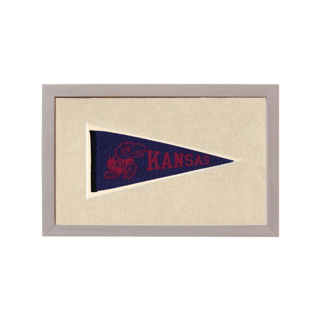 Framed vintage Kansas pennant in navy blue with red mascot