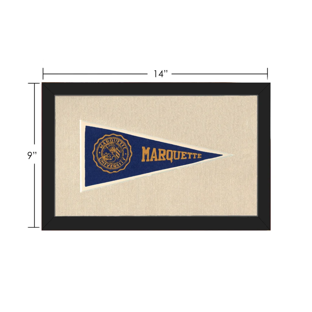 Framed vintage marquette university pennant in blue and gold displayed in a black frame for collectible vintage pennants