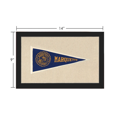 Framed vintage marquette university pennant in blue and gold displayed in a black frame for collectible vintage pennants