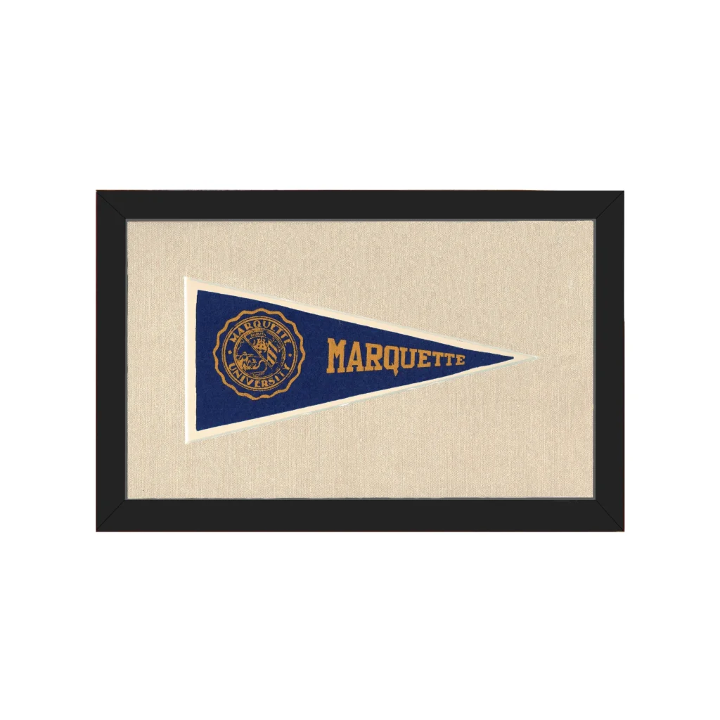 Vintage marquette university pennant in navy blue with gold lettering and emblem framed in black for wall display