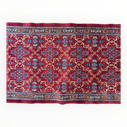 Vibrant rich red vintage Mashhad Persian runner rug with intricate blue and cream floral patterns on cotton foundation