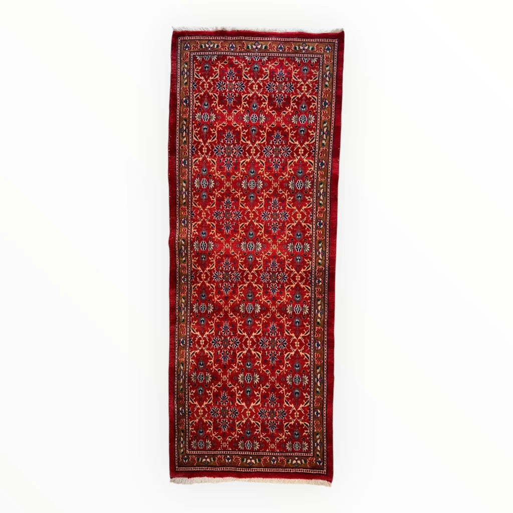 Vintage Mashhad rich red Persian runner rug with intricate floral patterns