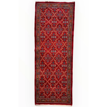 Vintage Mashhad rich red Persian runner rug with floral patterns