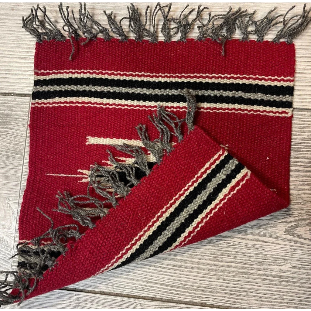 Vintage 1980s Mexican hand-knotted wool rug in red with black, white and gray geometric stripes and fringe