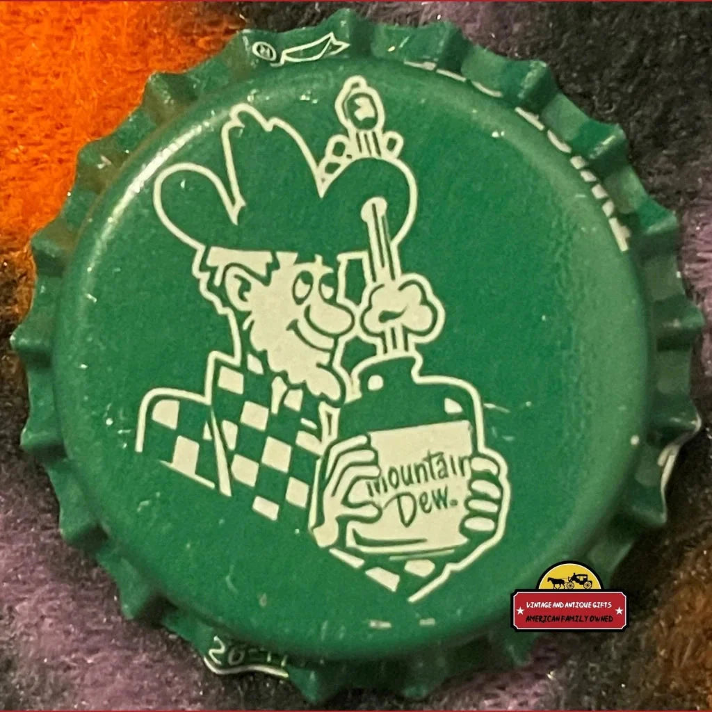 Green bottle cap featuring a cartoon character and Mountain Dew drink collectible