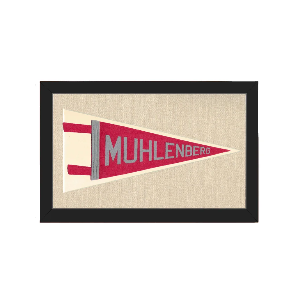 Framed vintage Muhlenberg College pennant in red, cream, and gray