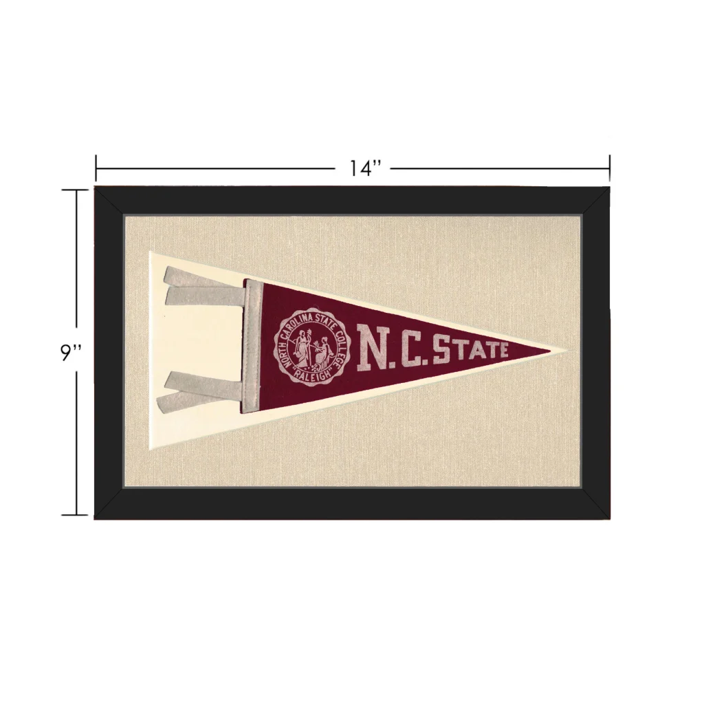 Vintage NC State pennant in maroon and cream, black framed