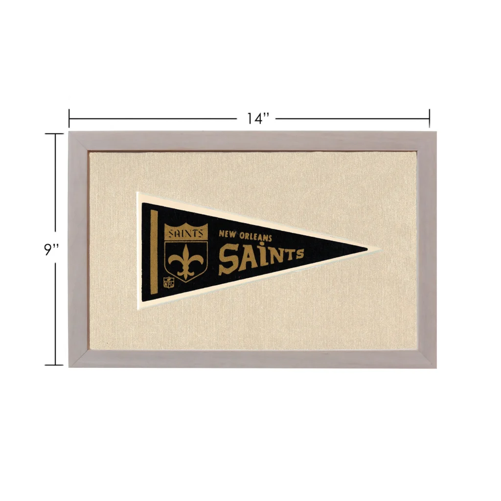 Vintage New Orleans Saints pennant in black, gold, and gray frame