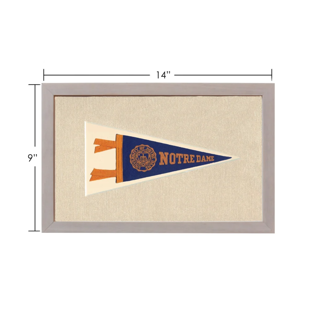 Vintage Notre Dame pennant in light gray frame on textured background