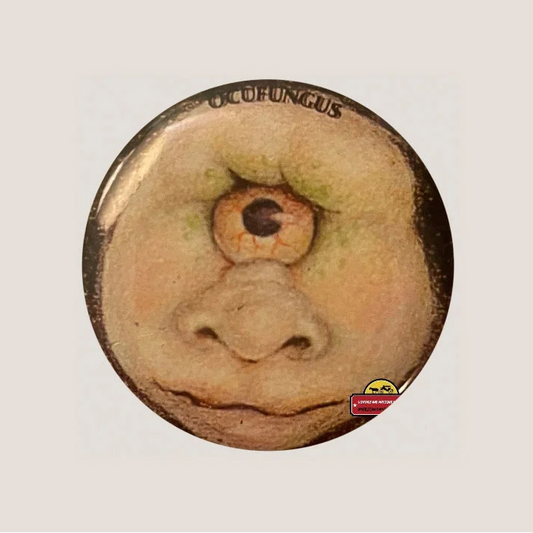 Vintage Ocufungus Pin showing one-eyed fleshy fun Garbage Pail Kids inspired design