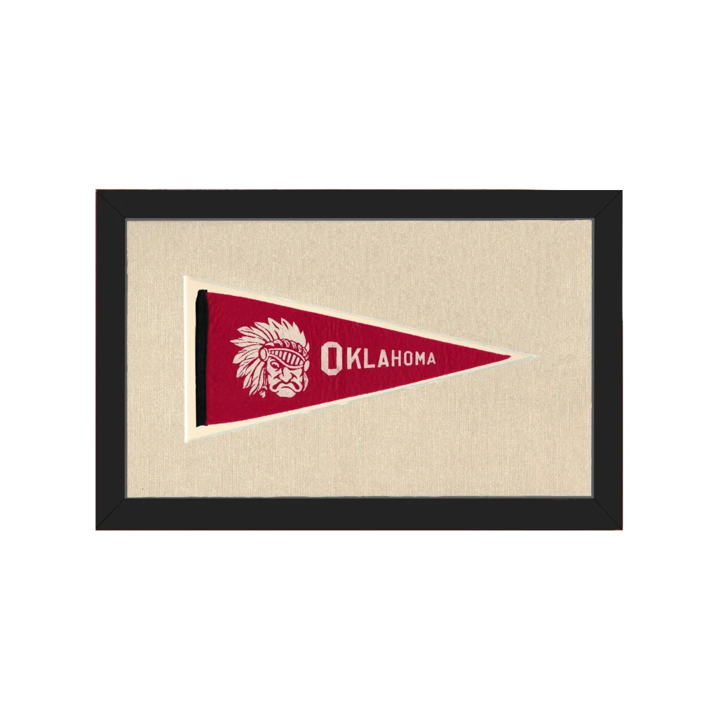 Vintage Oklahoma pennant with red design, white Native American chief emblem, framed in black