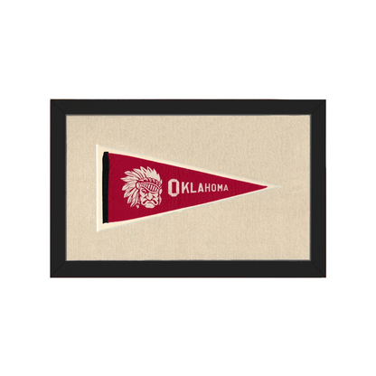 Vintage Oklahoma pennant with red design, white Native American chief emblem, framed in black