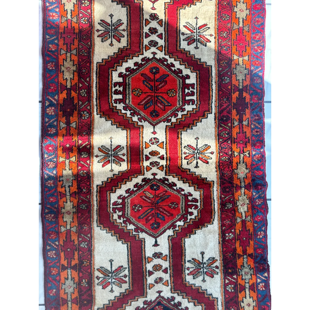 Vintage 1950s Persian Meshgi wool runner with red hexagonal medallion