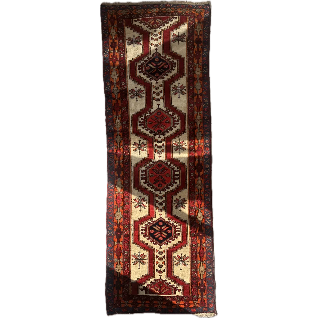 Vintage Persian Meshgi wool runner with geometric floral patterns