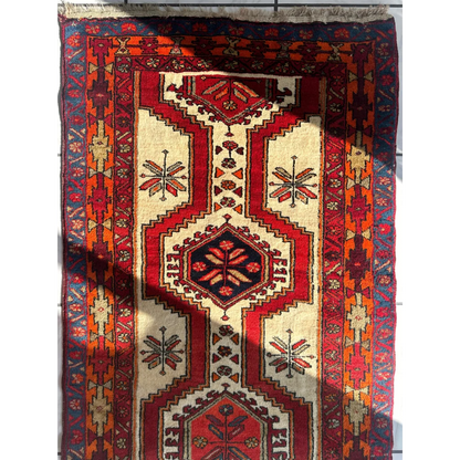 Vintage Persian Meshgi wool runner with red cream geometric patterns