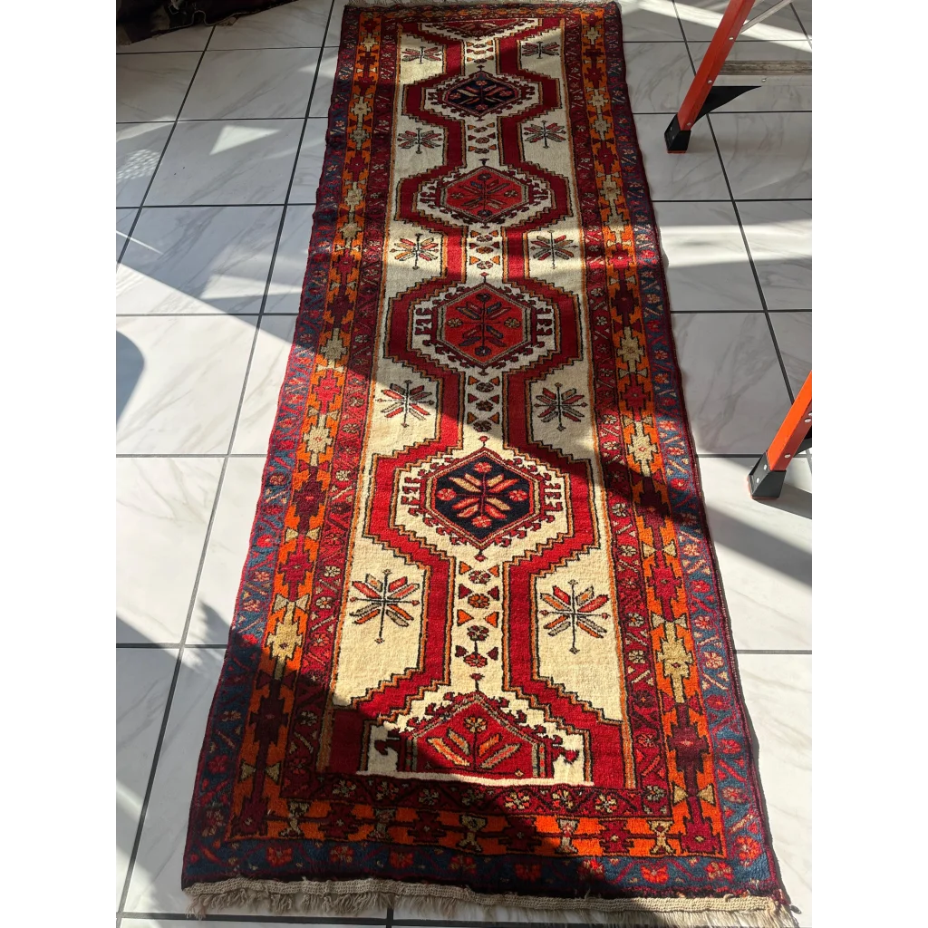 Vintage 1950s Persian Meshgi wool runner with red geometric patterns