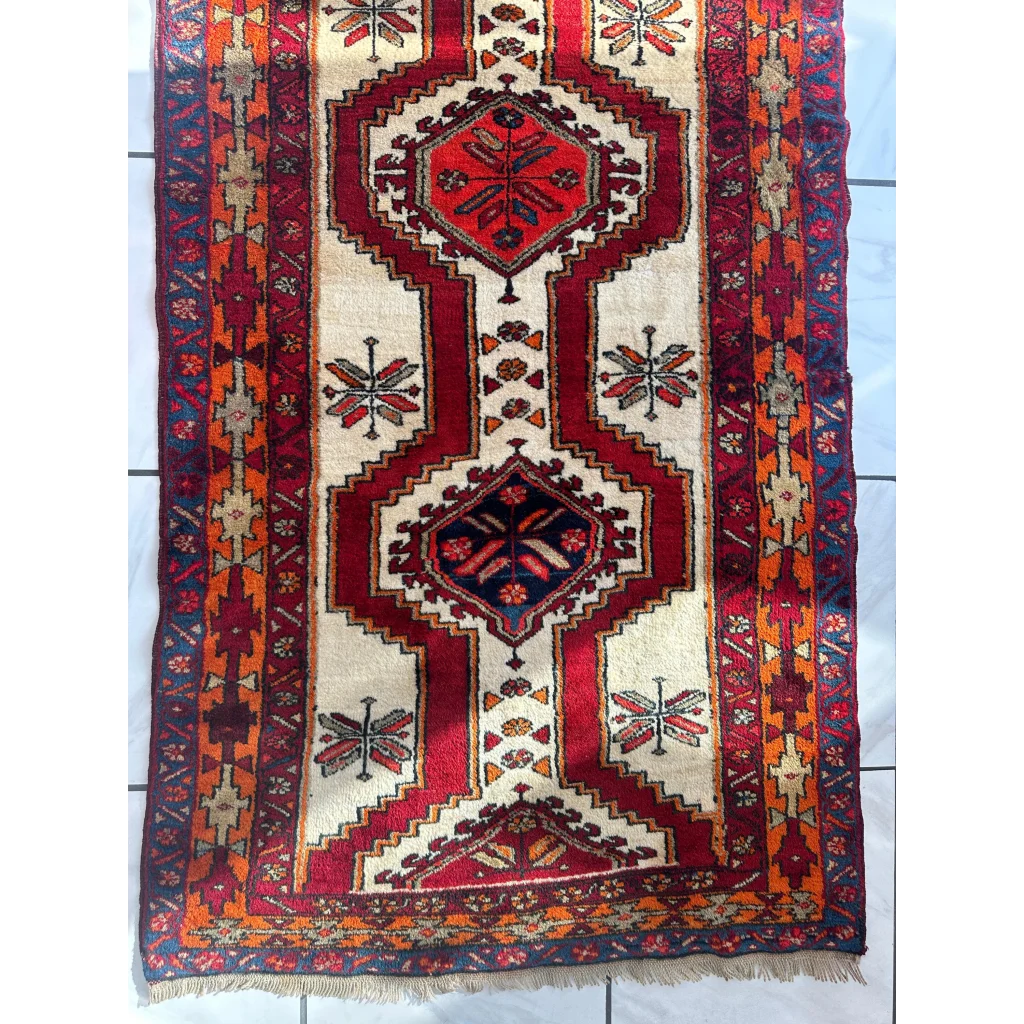 Vibrant red and cream Persian Meshgi wool runner with geometric designs