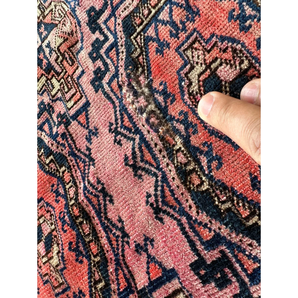 Hand touching Vintage Pink Geometric Rug Set Break with MLB career card note