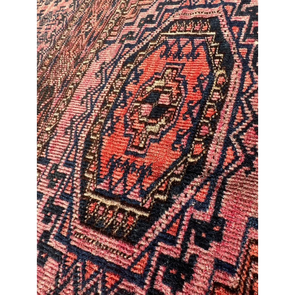 Vintage pink geometric rug with red-orange medallion, MLB career set break card note ready