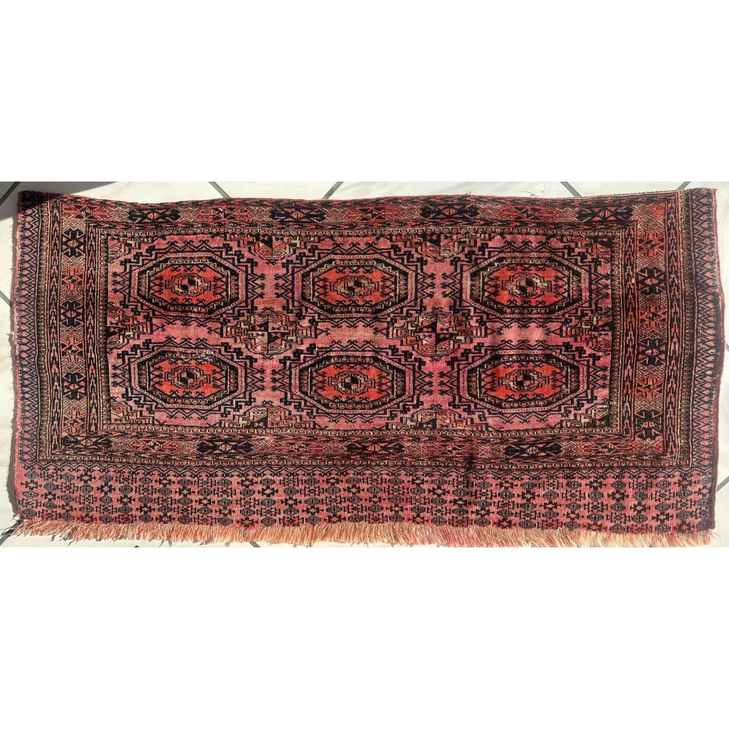 Vintage pink geometric rug with red brown octagons in MLB set break