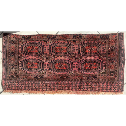 Vintage pink geometric rug with red brown octagons in MLB set break