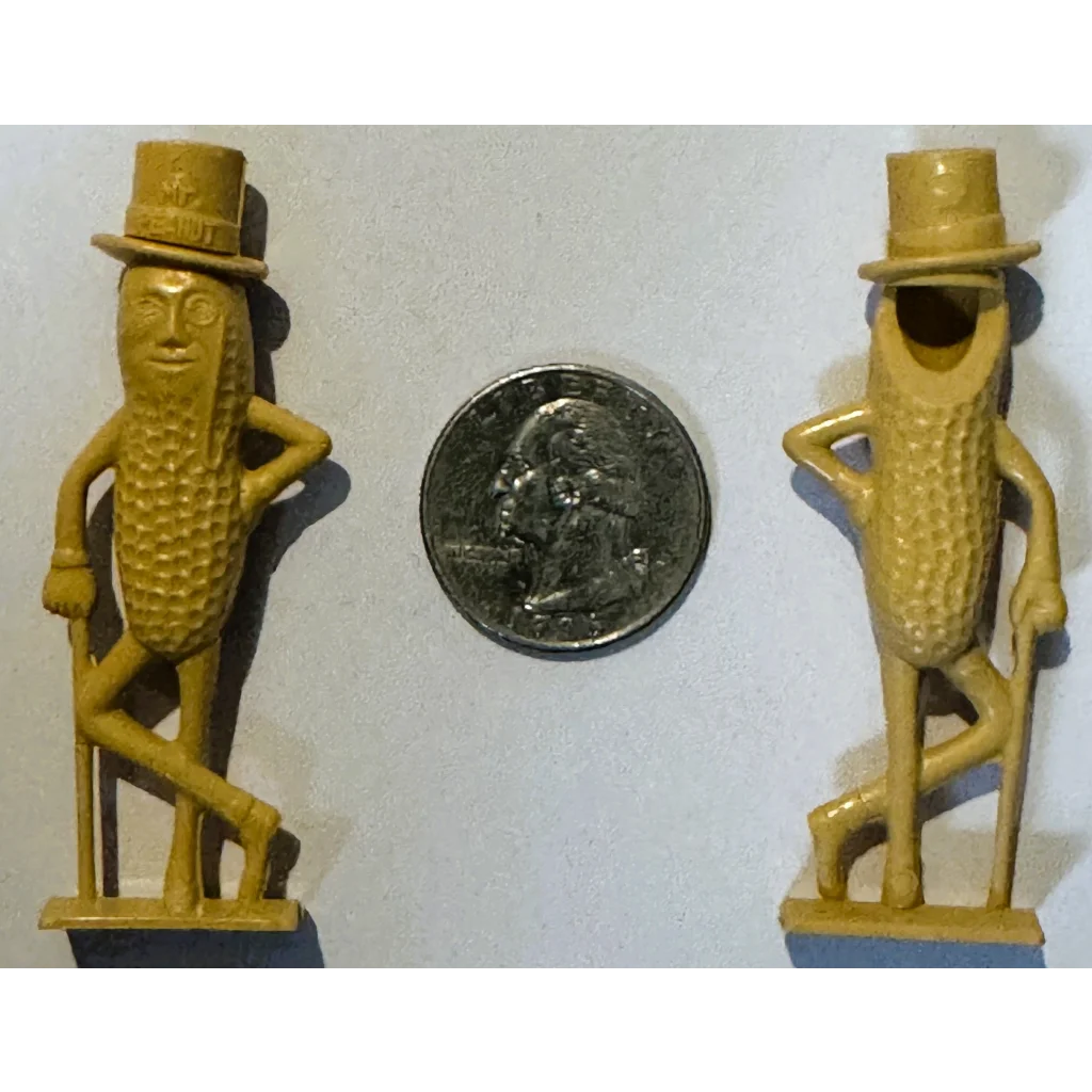 Vintage 1950s Mr. Peanut whistle collectible with two yellow top hat figurines