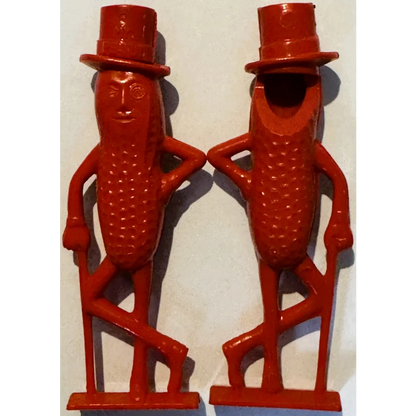 Two red Mr. Peanut figurines in top hats on bases, 1950s whistle collectible