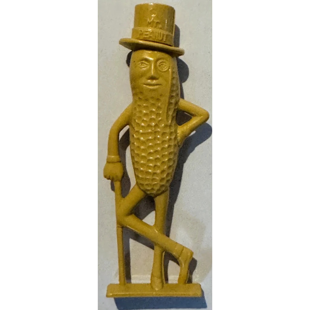 Vintage Planters Mr. Peanut whistle 1950s collectible with yellow cast iron mount
