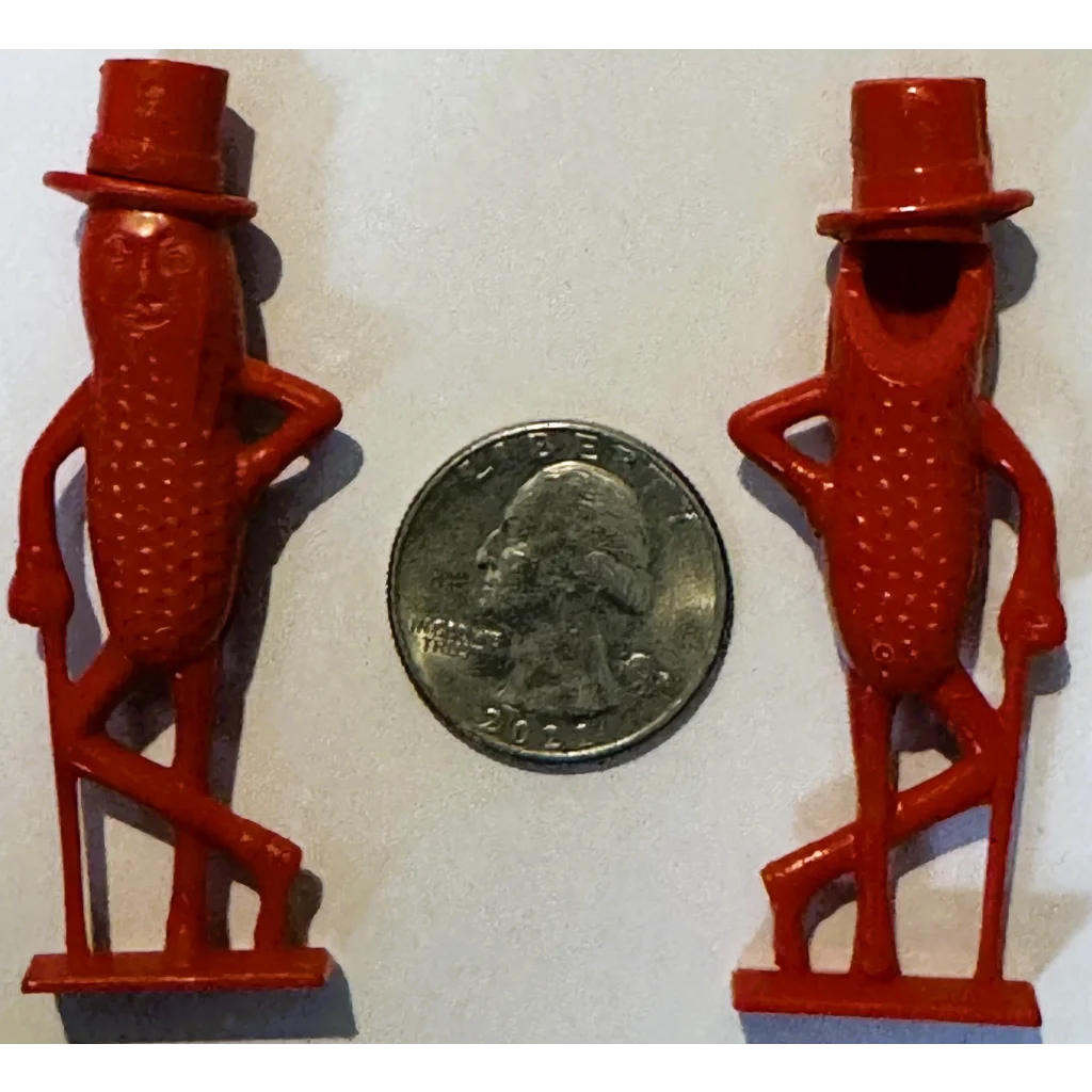 Two red Mr. Peanut top hat figures on base, 1950s whistle collectible