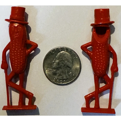 Two red Mr. Peanut top hat figures on base, 1950s whistle collectible