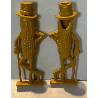 Vintage 1950s Mr. Peanut whistle collectible with two golden-yellow Mr. figures