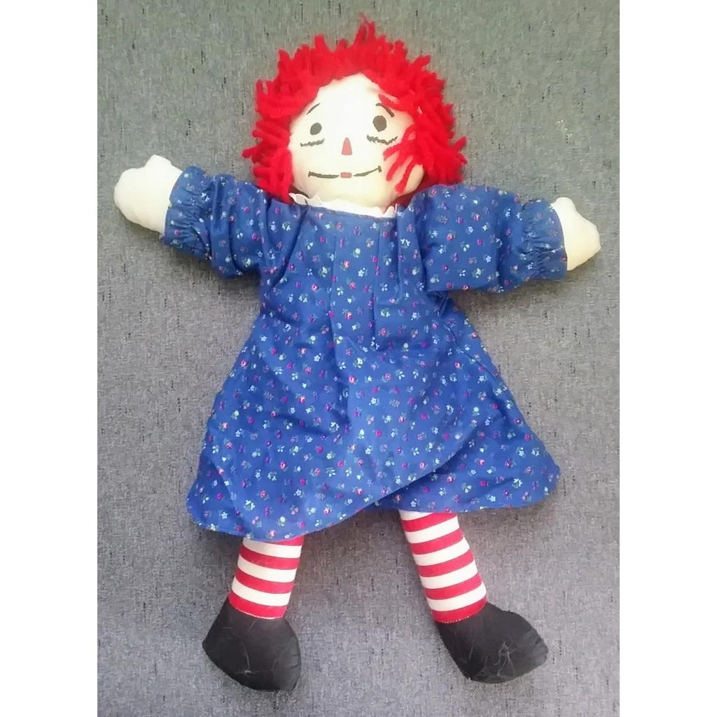 Vintage Raggedy Ann doll in blue polka dot dress with heart pillow