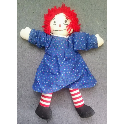 Vintage Raggedy Ann doll in blue polka dot dress with heart pillow