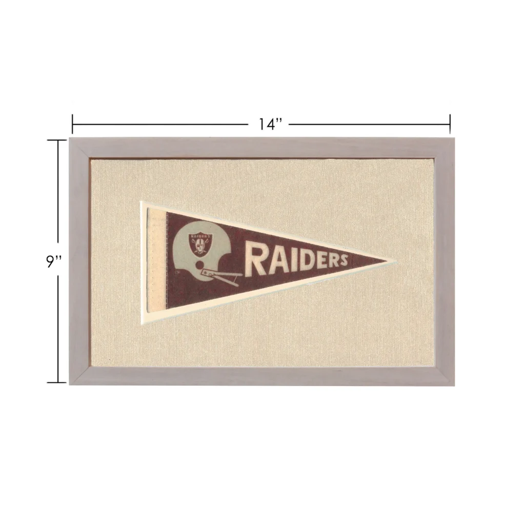 Vintage Raiders pennant framed with brown background