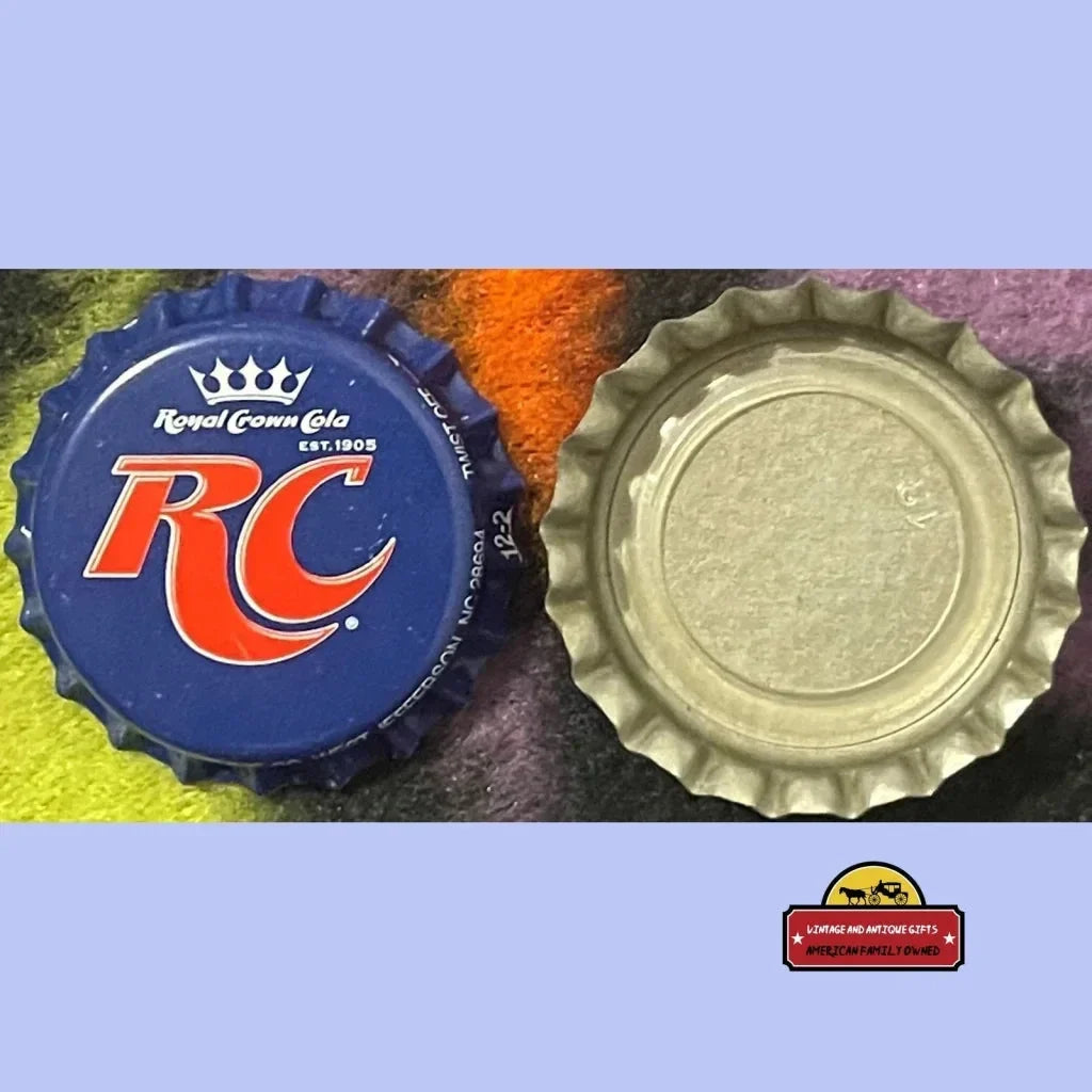 Bottle caps from Royal Crown Cola featuring a blue logo and plain silver design