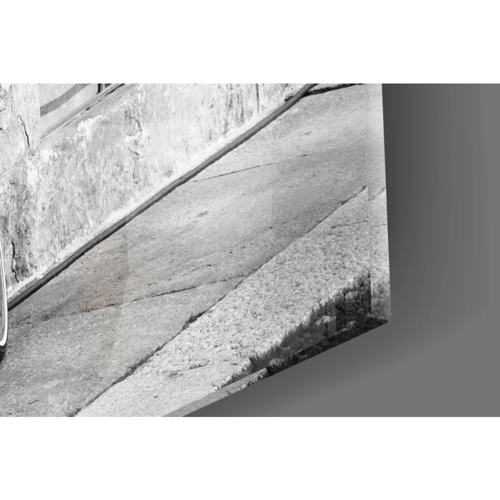 Vintage red bicycle wall art with basket on black and white concrete steps