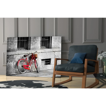 Vintage red bicycle metal wall art with basket on black and white background