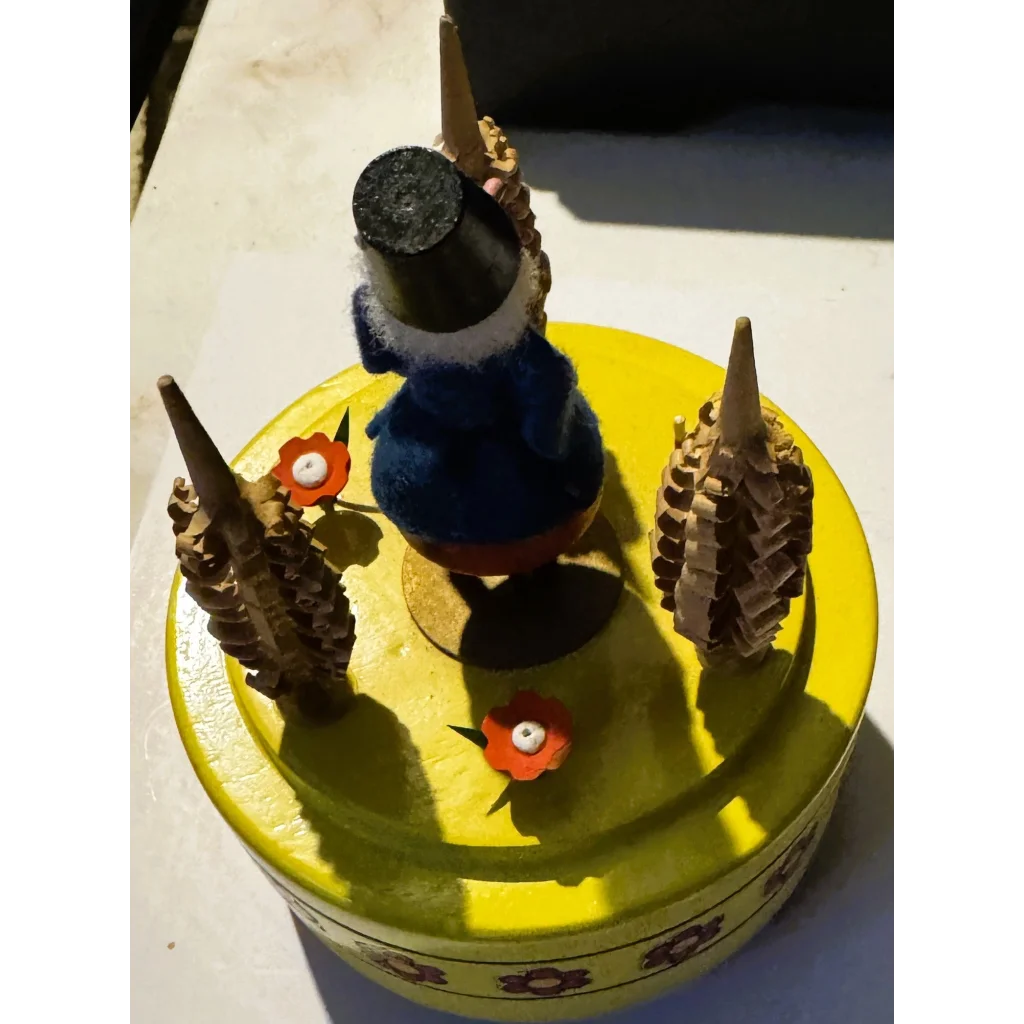 Yellow Reuge music box with gnome, vintage Swiss clock components, perfect for collectors